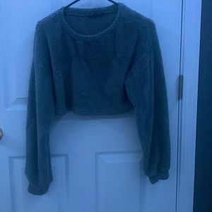 A soft comfortable Cropped long sleeve shirt. Furry inside as well.